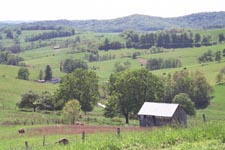 LAND:  farmland in upper watershed with wooded hills in background