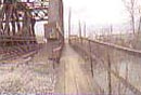 Pedestrian walkway by railroad bridge across Chartiers Creek.  
